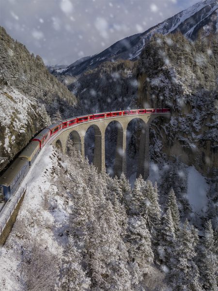 switzerland-landwasser-viaduct-train-bernina-express-roadtrip-snow-winter